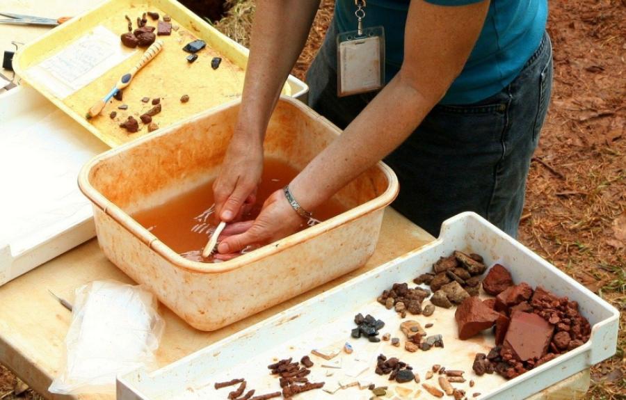 Someone on cleaning pottery sherds 